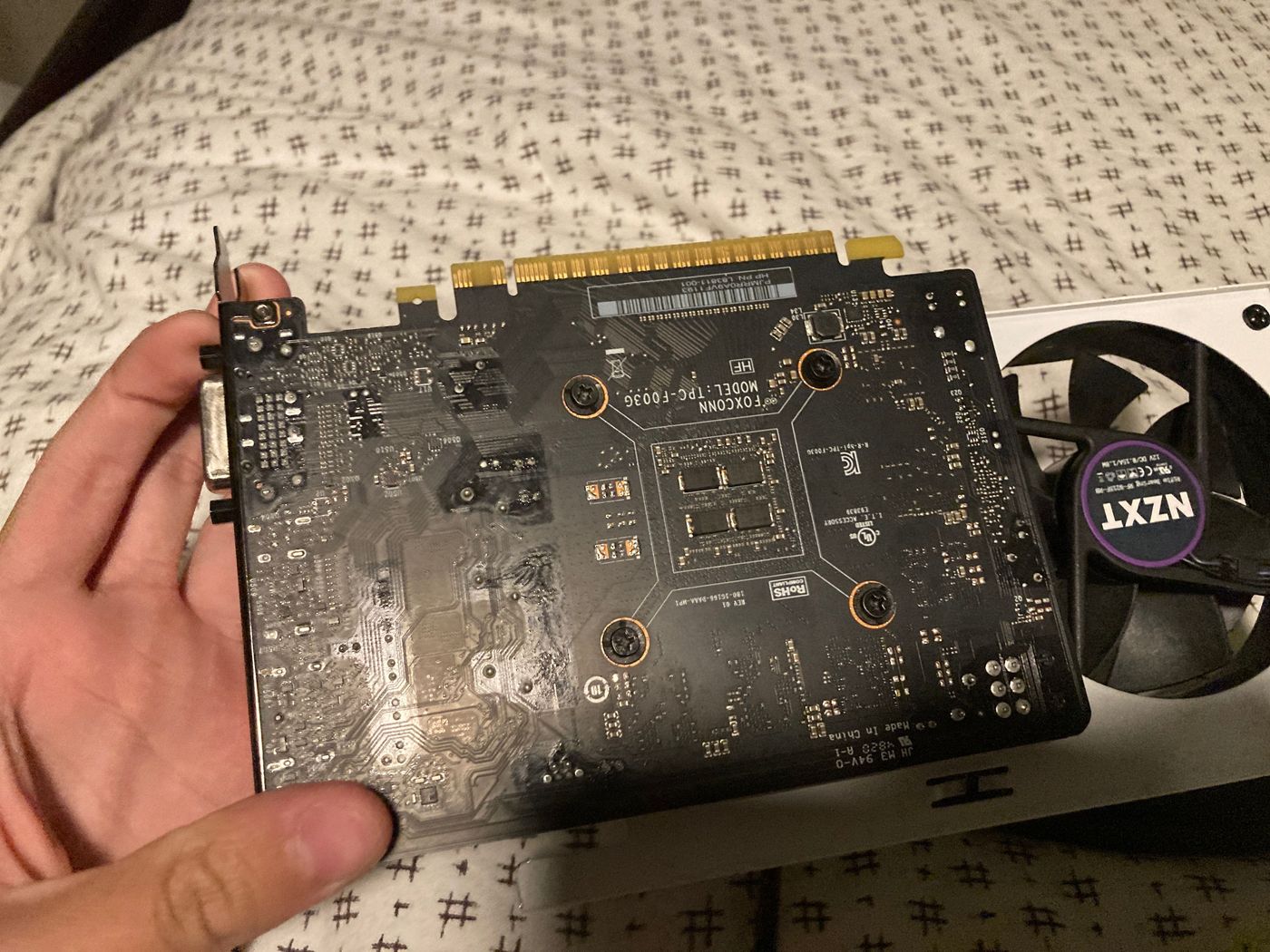 Back of the card — bare PCB with no backplate, VRAM chips exposed