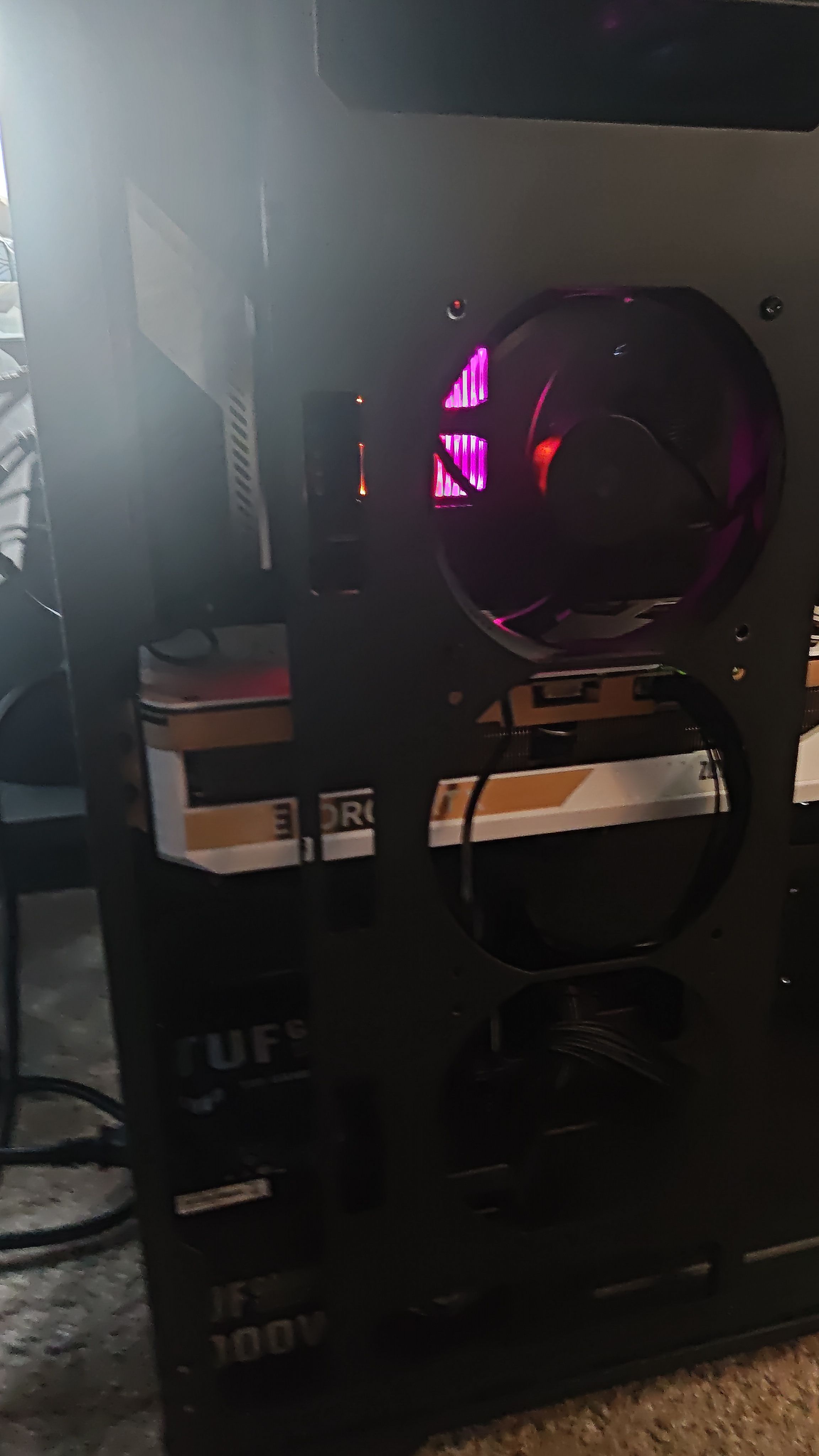 Side view showing the RAM sticks with purple lighting and the build interior