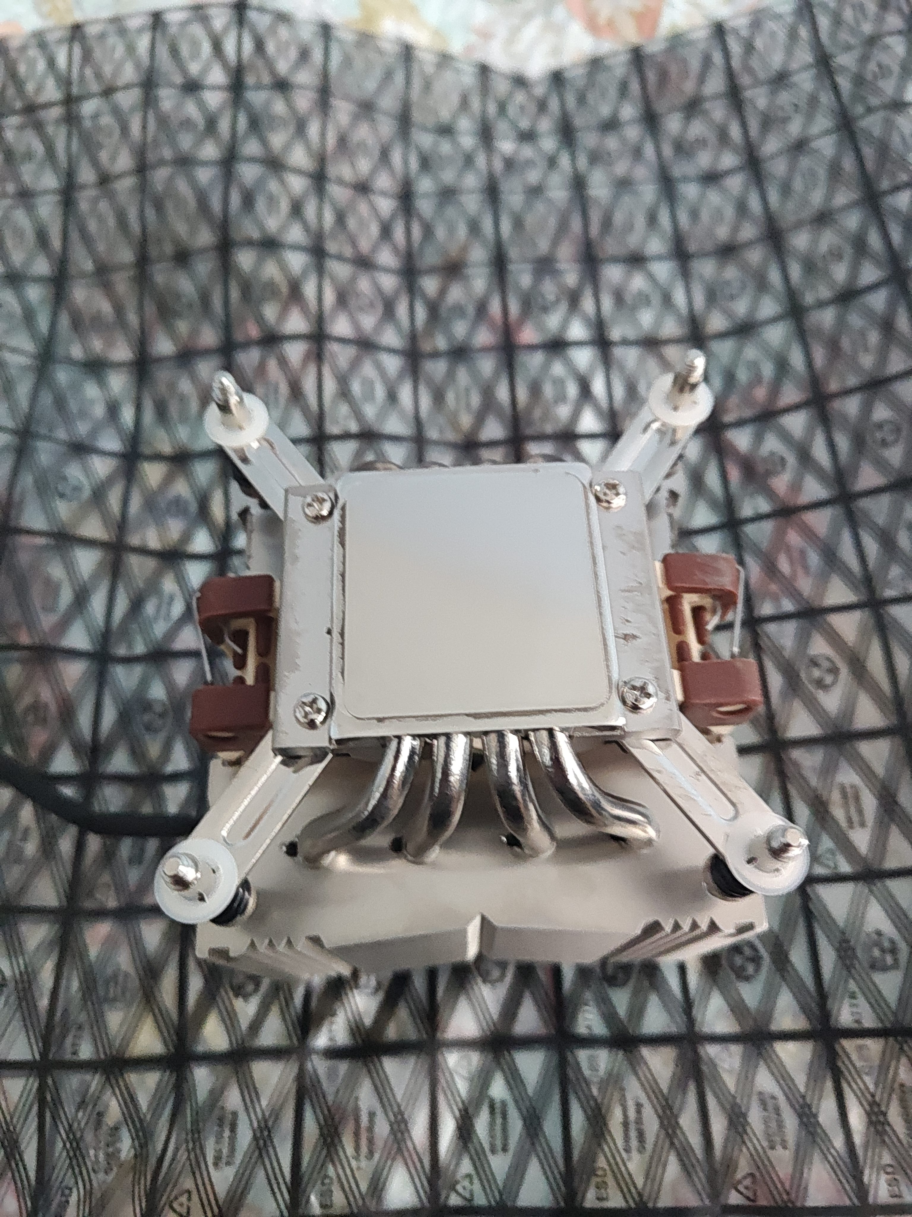 Noctua NH-D9DX i4 3U — underside showing copper cold plate and Square-ILM mounting hardware