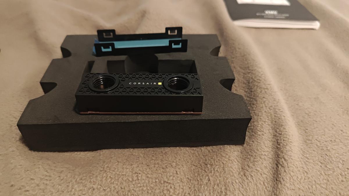 Corsair XM2 box open — manual and documentation visible on top layer