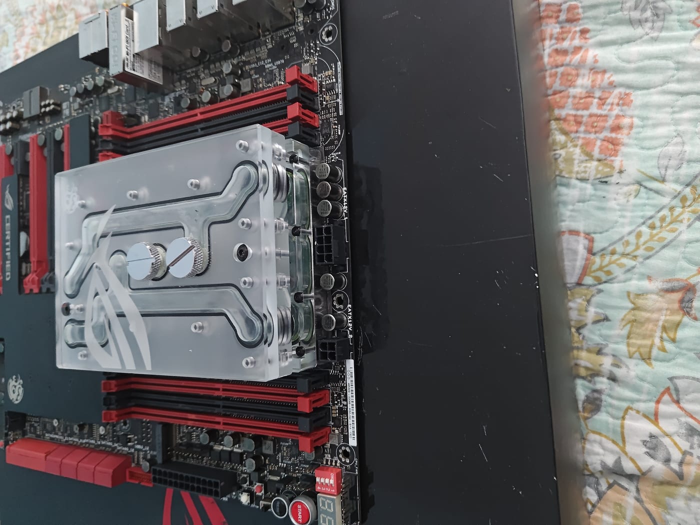 Top of Rampage V Extreme showing dual 8-pin and 4-pin CPU power connectors