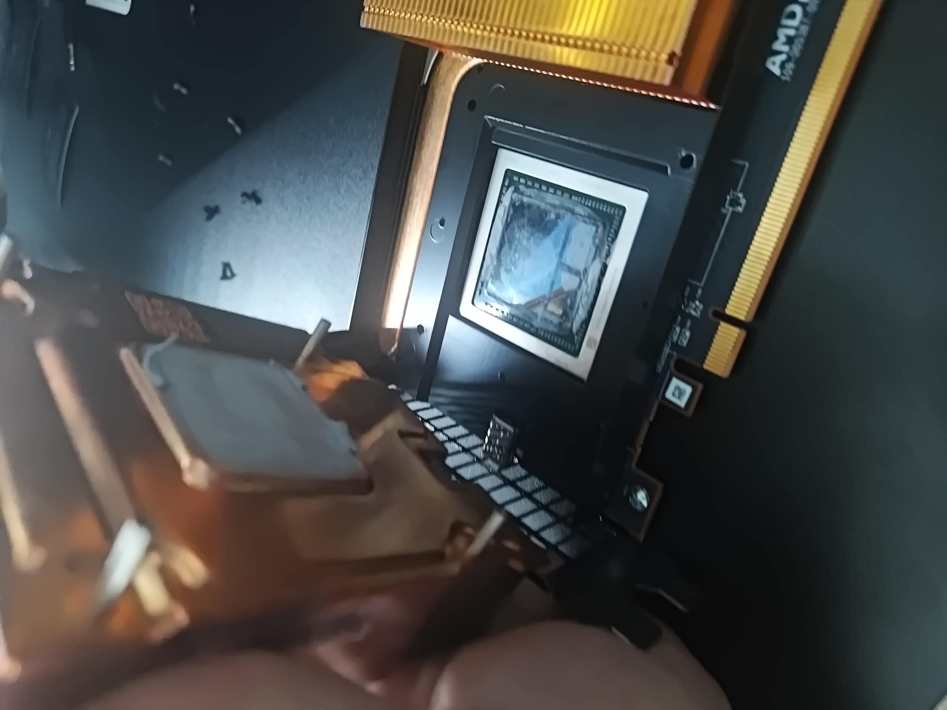 Left GPU heatsink being lifted off Radeon Pro V340L