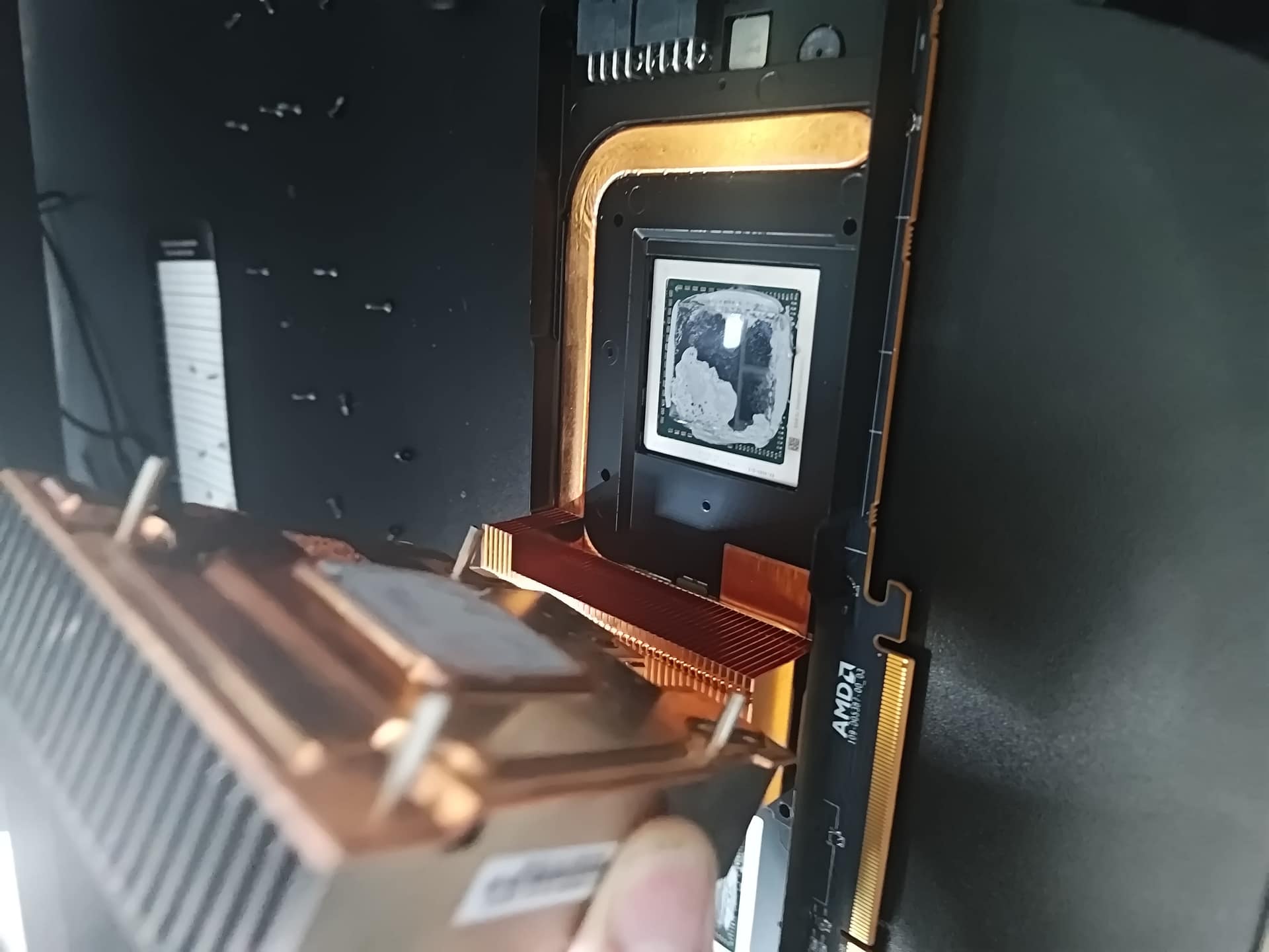Right GPU heatsink being lifted off Radeon Pro V340L