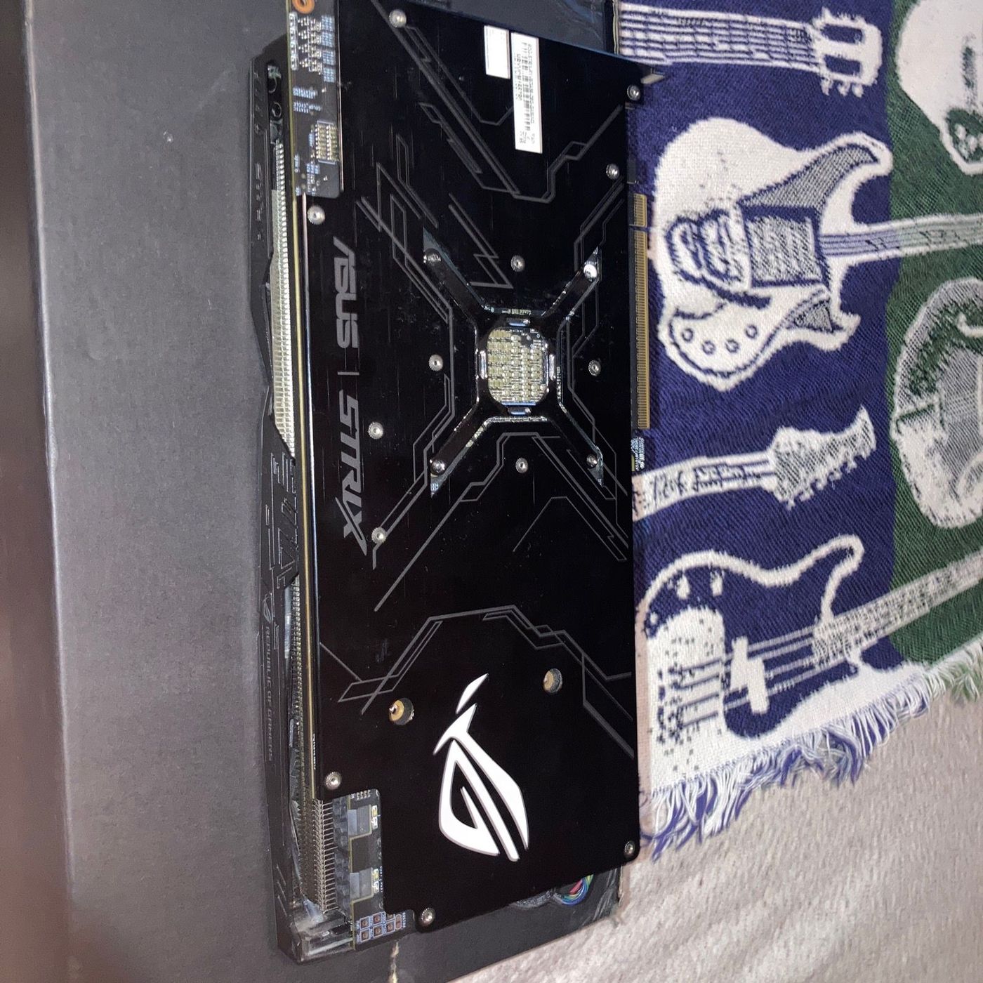 Backplate — ASUS STRIX branding, ROG logo, full metal backplate