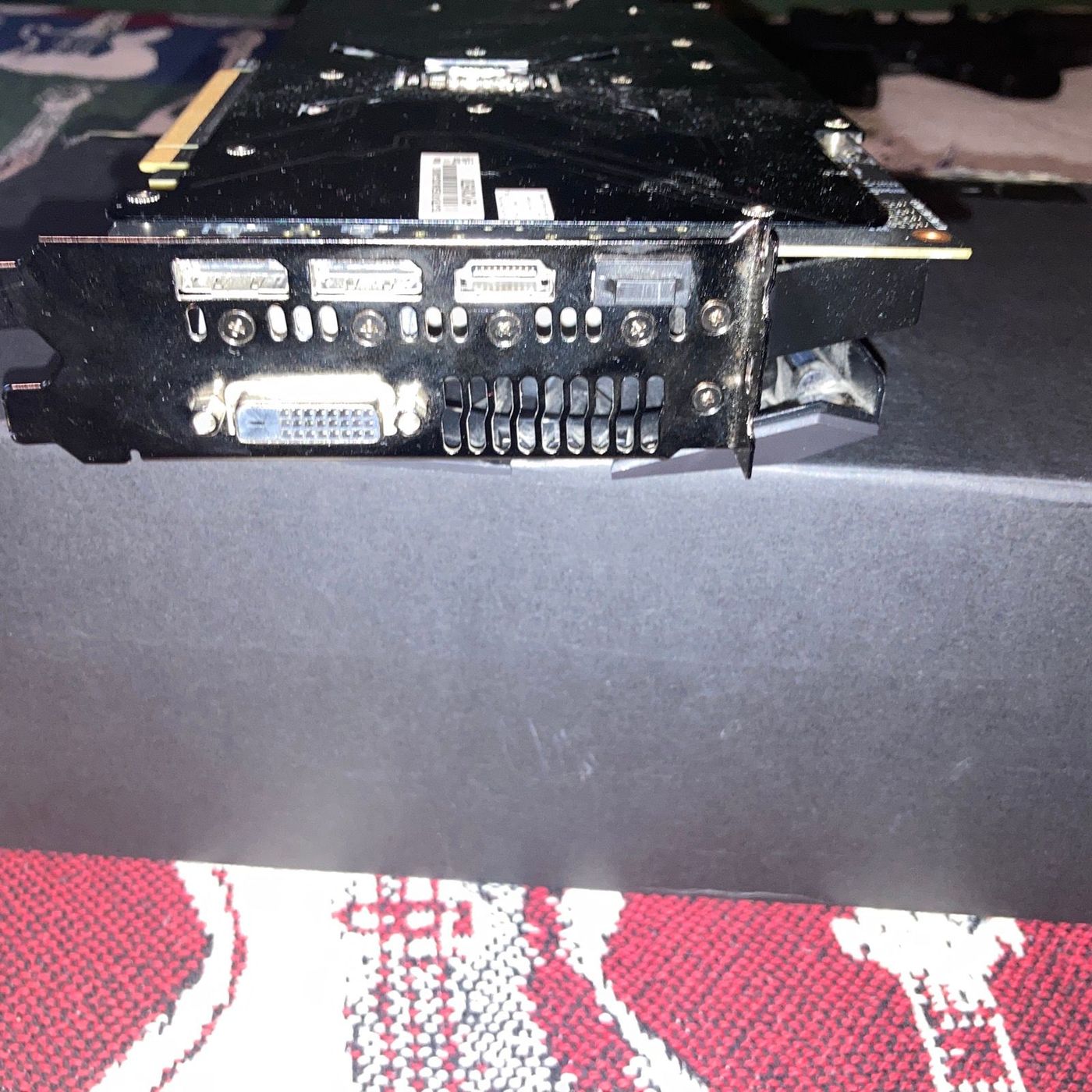 I/O bracket — three DisplayPort outputs and one DVI port