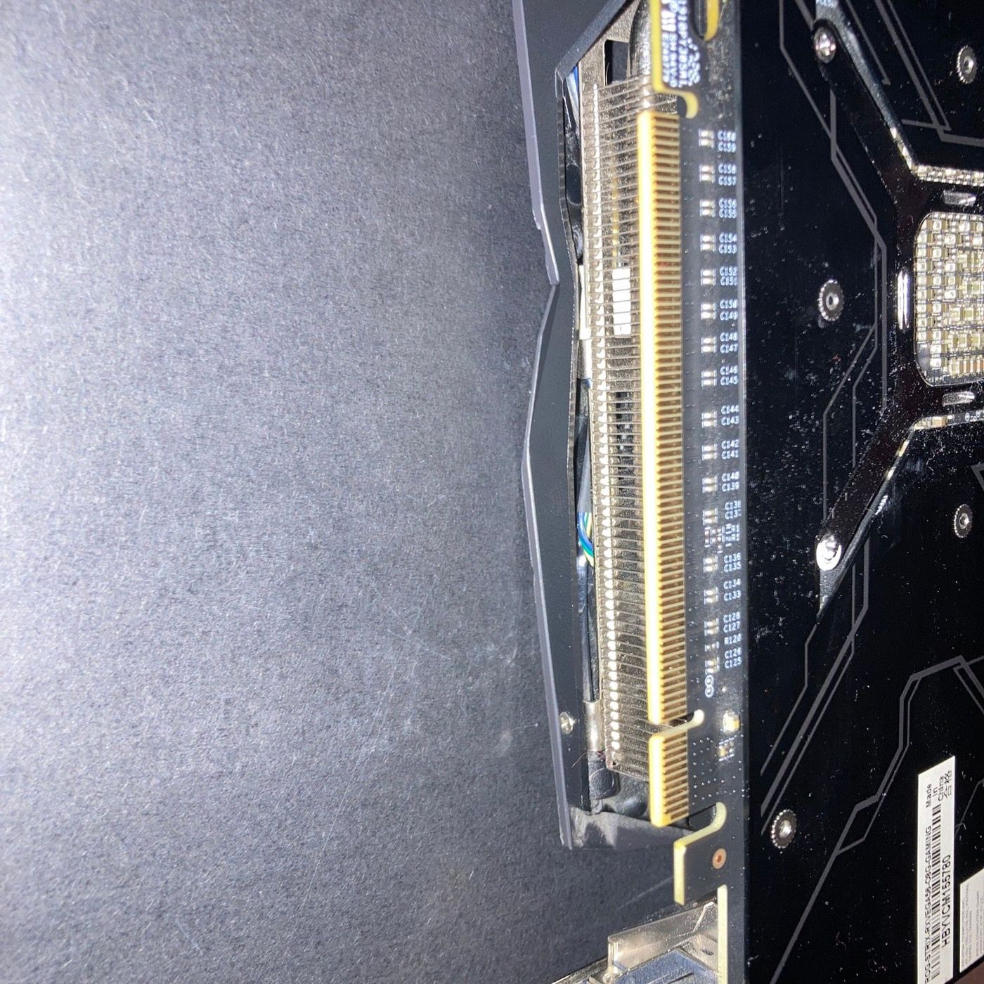 PCIe connector close-up — gold fingers, edge of the PCB
